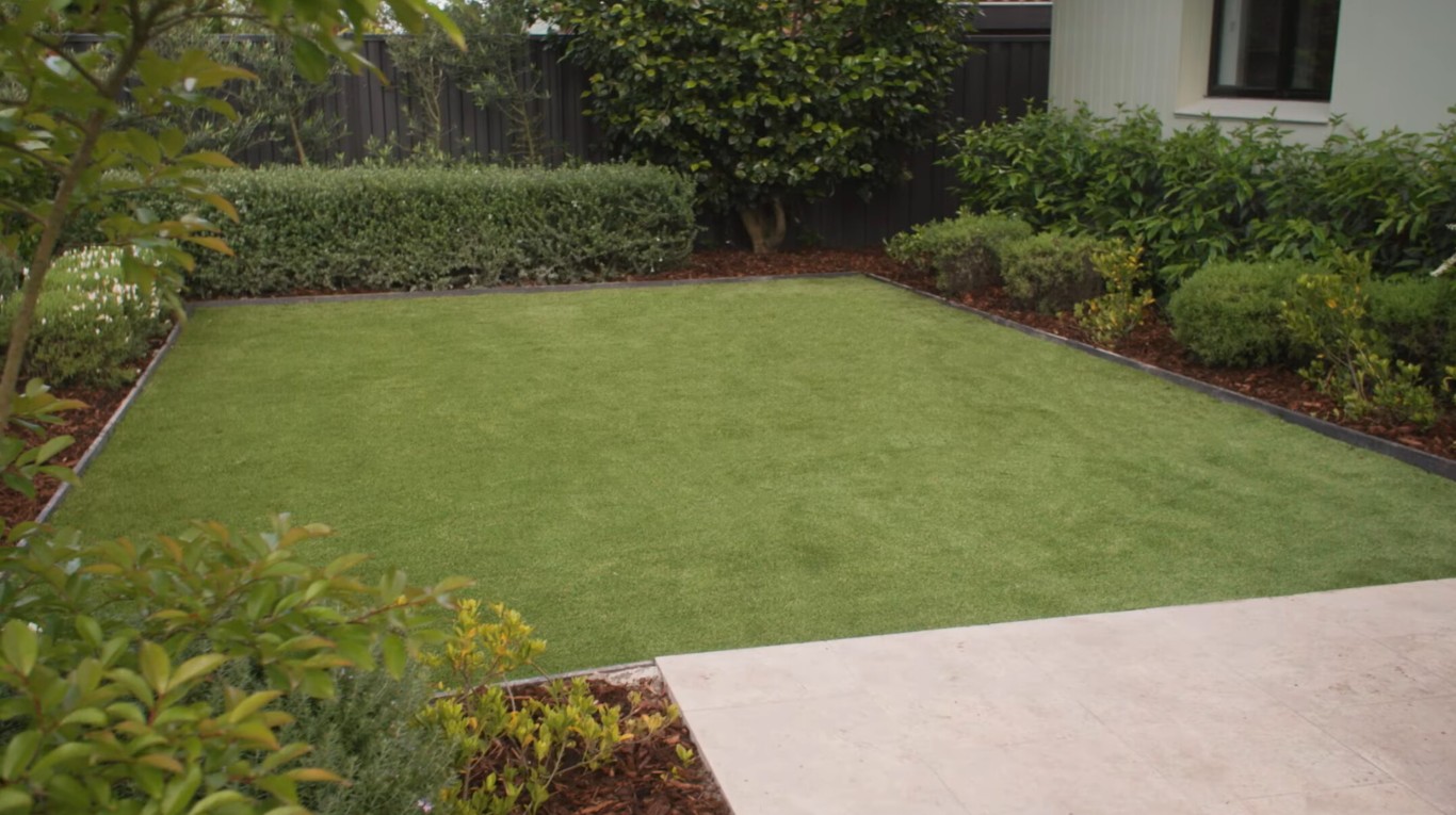 Professional artificial grass installation in Asheville backyard
